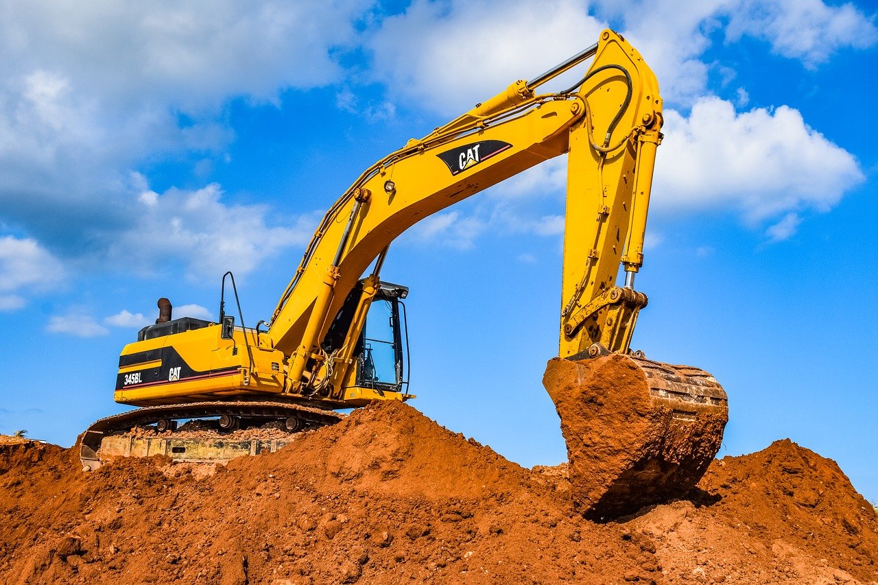 Digger excavating land for sale in Spain