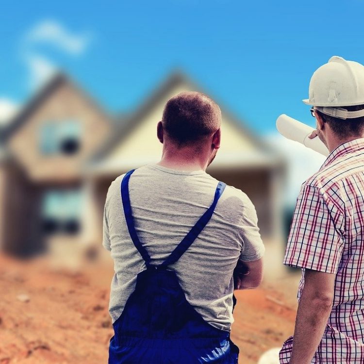Builders in Spain assessing a property